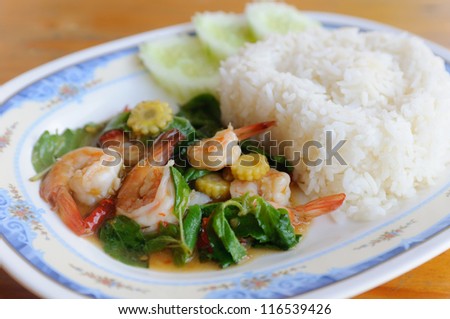 Thai food. rice and shrimp with sweet and spicy sauce, stir and serve with rice. Shallow depth of field.