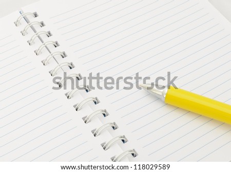Notebook with yellow pen