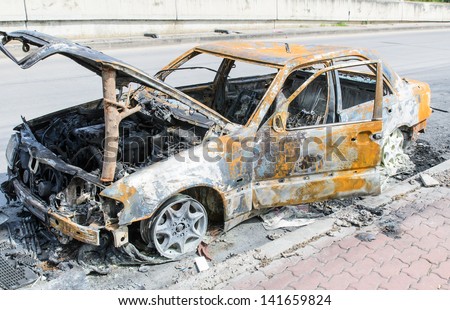 Burnt out car wreck after a fire