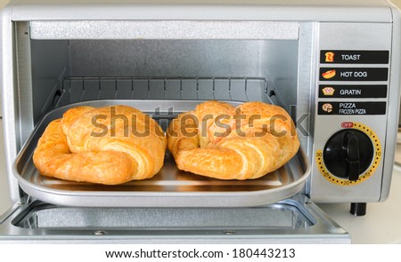 Croissant on plate in Electric oven