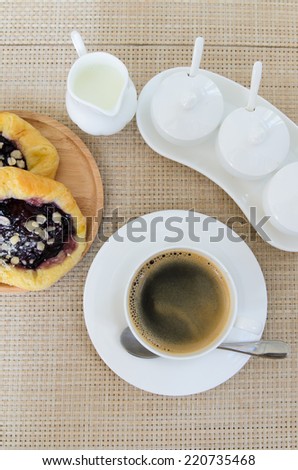 Coffee and bread on table