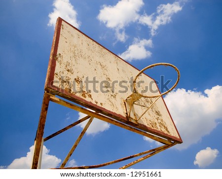 old basketball ring against blue sky