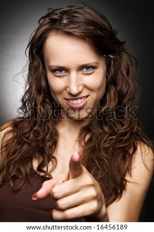 young woman pointing her finger at you