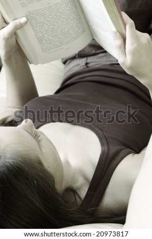 desaturated image of woman that reading book at home