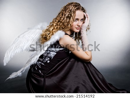 stock photo sad angel sitting on the floor