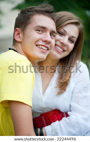 portrait of smiley couple in park