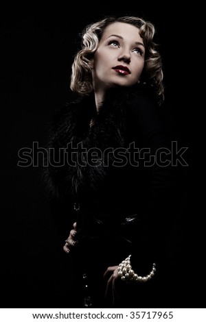retro portrait of attractive blonde against black background