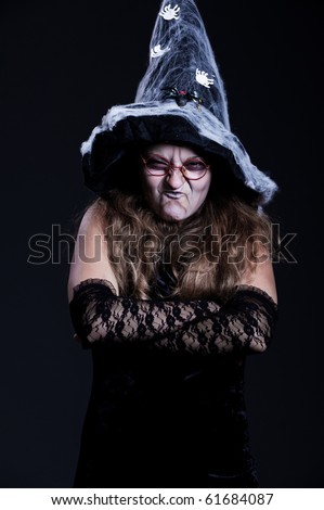 portrait of witch over dark background. halloween theme