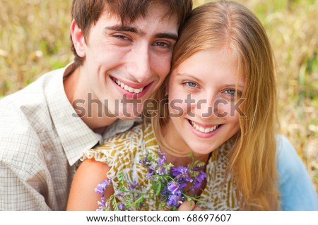 outdoor portrait of happy smiley couple