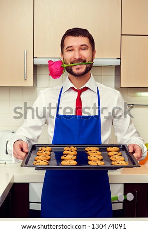happy man had baked festive cookies for his woman