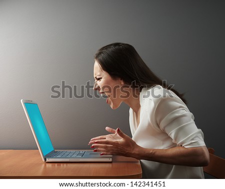 screaming angry woman with laptop