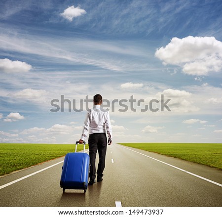 back view of businessman with blue bag