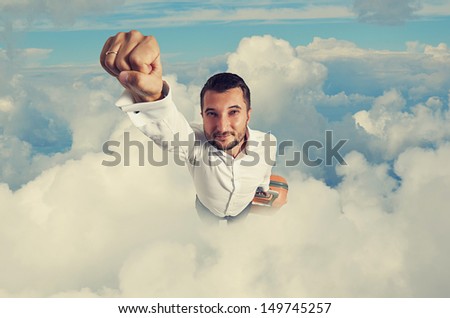 Super Hero Businessman With Suitcase Flying Through The Clouds