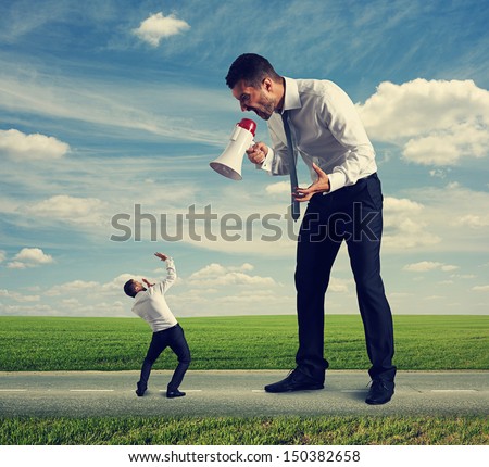 big man standing on road and screaming at the small man