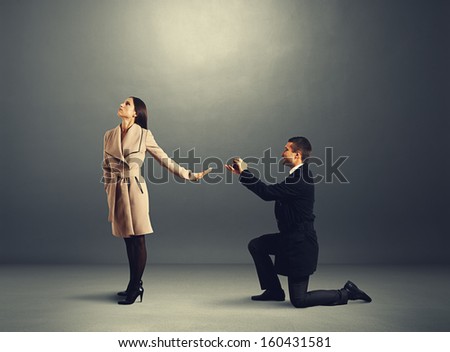 handsome man making proposal of marriage the woman