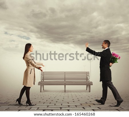 happy couple going to meet each other in the park