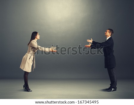 young beautiful couple going to meet each other in the dark room