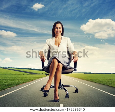 smiley successful businesswoman sitting on the office chair at outdoors