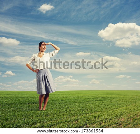 smiley young woman looking into the distance