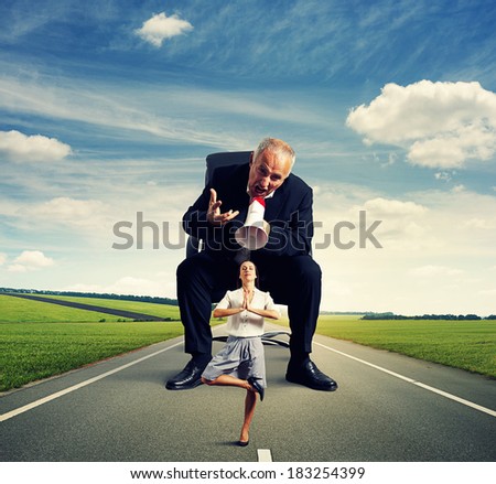 aggressive senior man and calm young woman on the road