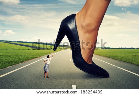 angry woman showing fist and screaming at big lady boss on the road