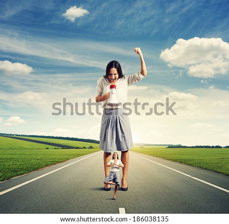 dissatisfied woman and calm yoga woman on the road