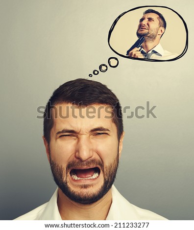 concept photo of stressed screaming man. in speech balloon crying man with gun. photo over grey background