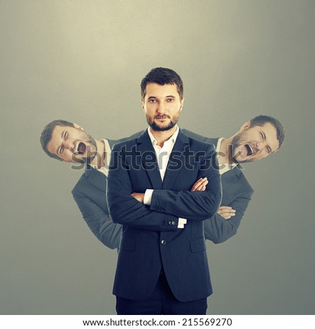 two screaming men behind confident businessman in suit over dark background