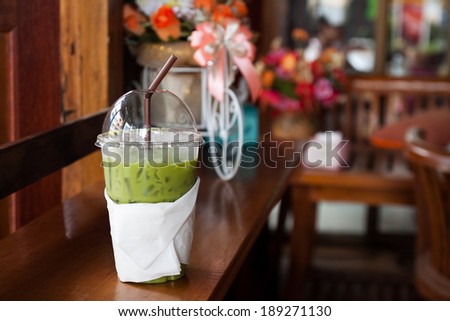 milk green tea smoothie in plastic cup