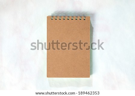 Brown front cover notebook isolated on Mattress White background