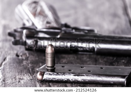 vintage handgun bullets on magazine