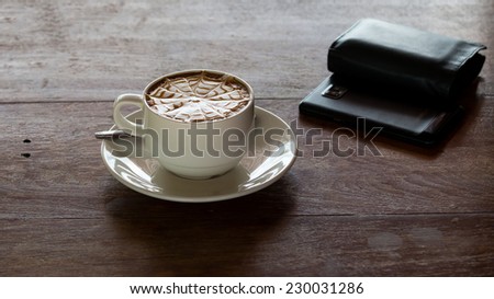 coffee cup on table and mobile phone,wallet