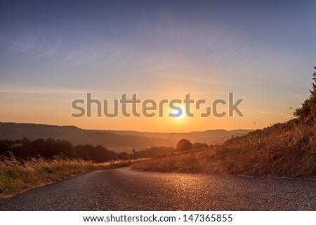 Beautiful Picture of a small road in the morning sun, shot on the trekking trail in Bavaria, Germany