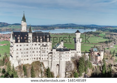 Neuschwanstein, Lovely Autumn Landscape Panorama Picture of the fairy tale castle near Munich in Bavaria, Germany with colorful trees