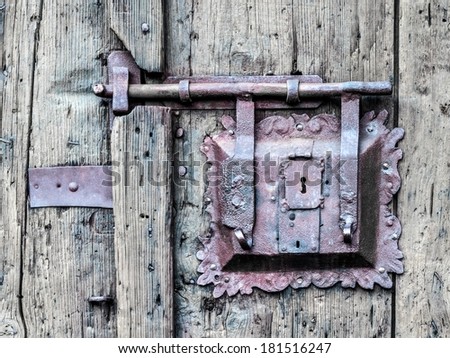 Vintage doorknob on antique door, background. Impressive wooden door from the medieval city of Bamberg in Bavaria, Germany / Europe, Unesco world culture heritage