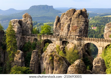 Bastion Bridge in the Saxonian Swiss in Germany, shot on a summer morning after sunrise. Landmark of Saxony. Sandstone Rock Formations. Bridge leading to a former medieval castle near Dresden