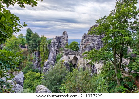Bastion Bridge in the Saxonian Swiss in Germany, shot on a summer morning after sunrise. Landmark of Saxonia. Sandstone Rock Formations. Bridge leading to a former medieval castle near Dresden