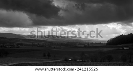 Dramatic Winter Landscape. German Winter Countryside with hills and barren trees. Castle on a hill. Lovely fairytale landscape
