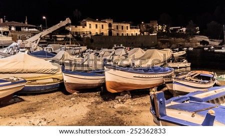 Lovely Picture of the Palermo coastline with boats at night on the beach