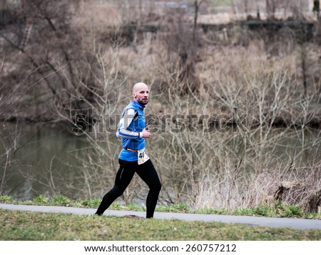 BAMBERG, GERMANY - MARCH 15 2015: Kaiserdomlauf, traditional long distance race event in the City of Bamberg in Bavaria, Germany in March 2015. Man running