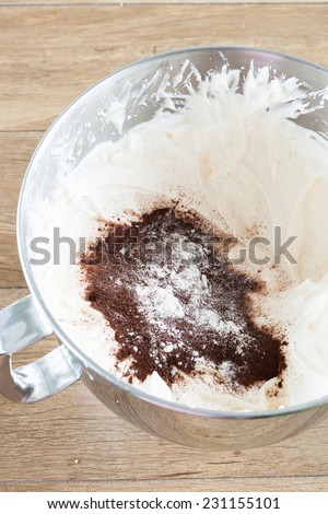 Adding dry ingredients to the Whipped Eggs (Making Cake Filling)