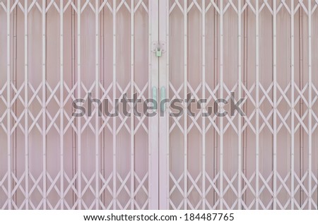 Pink metal grille sliding door with pad lock and aluminum handle