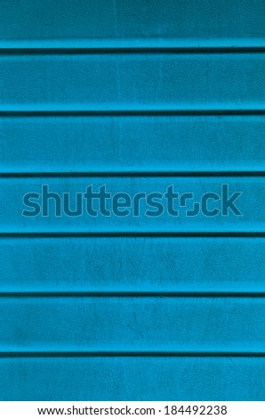 Grungy light blue plastic wall sheathing cover fragment