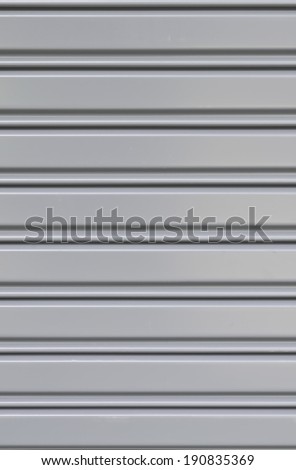 Gray corrugated metal sheet slide door texture