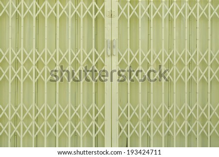 Yellow metal grille sliding door