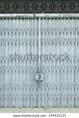 Light blue old metal grille sliding door