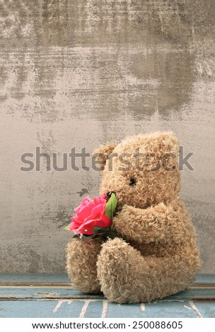 cute bear doll holding rose bouquet in vintage style
