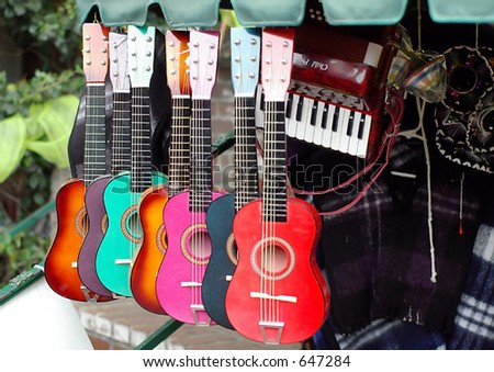 colorful guitars in musical instruments shop