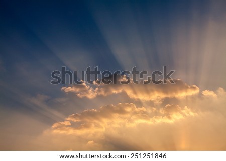 Rays of  light through the sky with clouds