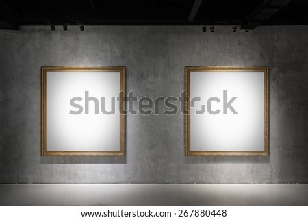 Two blank Antique golden frame on concrete wall in gallery room